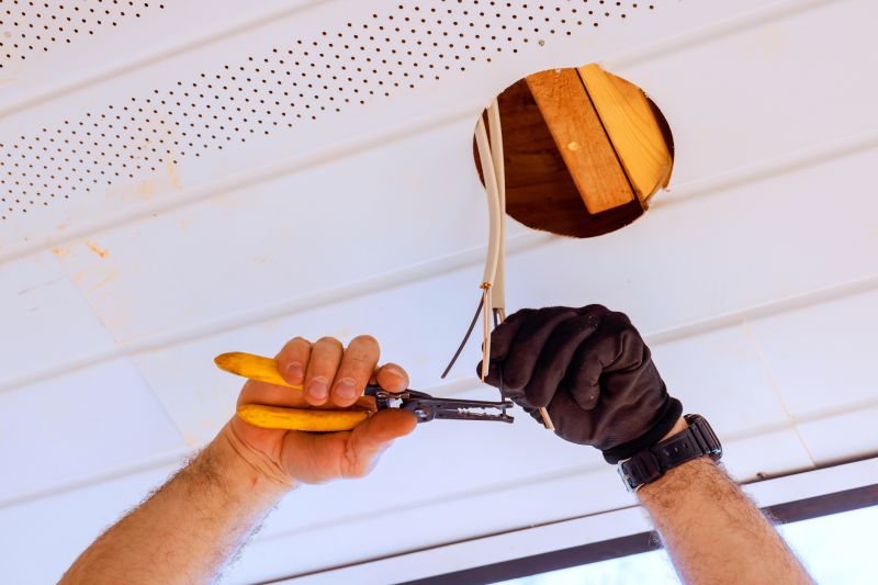 Electrician Installing a Light Fixture
